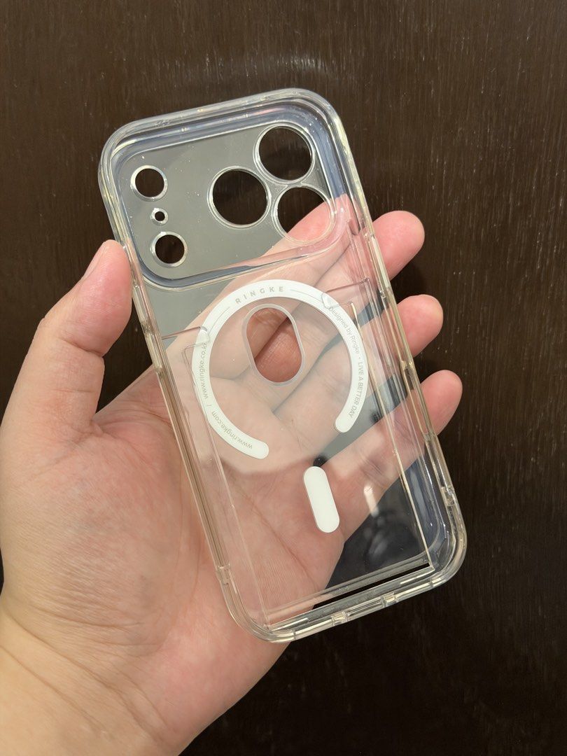 iPhone 17 Pro Ringke Card Case Magsafe Magnetic Clear Camera Button (Category: Cases & Sleeves) located in Quezon City. Submitted by dreeeeeeee (Listing ID 1466018033, Image 2). Description: * for iPhone 17 Pro only (NOT Max) * With camera protector/cover * Fits 1 card * Magsafe charging compatible (just remove the card) * Very slight yellowing * Near LRT 2 Gilmore Station (condo lobby) po for Lalamove, Grab, or pickup.