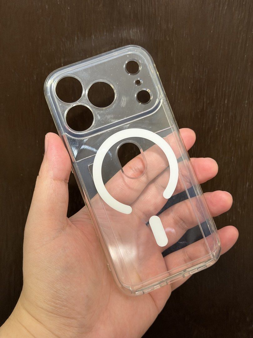 iPhone 17 Pro Ringke Card Case Magsafe Magnetic Clear Camera Button (Category: Cases & Sleeves) located in Quezon City. Submitted by dreeeeeeee (Listing ID 1466018033, Image 1). Description: * for iPhone 17 Pro only (NOT Max) * With camera protector/cover * Fits 1 card * Magsafe charging compatible (just remove the card) * Very slight yellowing * Near LRT 2 Gilmore Station (condo lobby) po for Lalamove, Grab, or pickup.