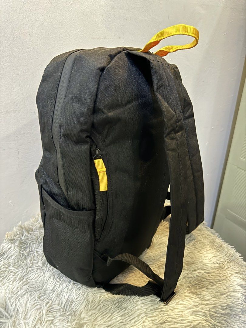 iQOO Monster Inside Black Backpack with Yellow Accents (Category: Backpacks) located in Urdaneta. Submitted by kathleenja24136 (Listing ID 1465958147, Image 3). Description: - Authentic black iQOO backpack with vibrant yellow accents - Features a cool round 'Monster Inside' logo patch on the front - Secure main compartment zip closure and front zippered pocket - Convenient side slip pockets for water bottles or essentials - Comfortable top grab h
