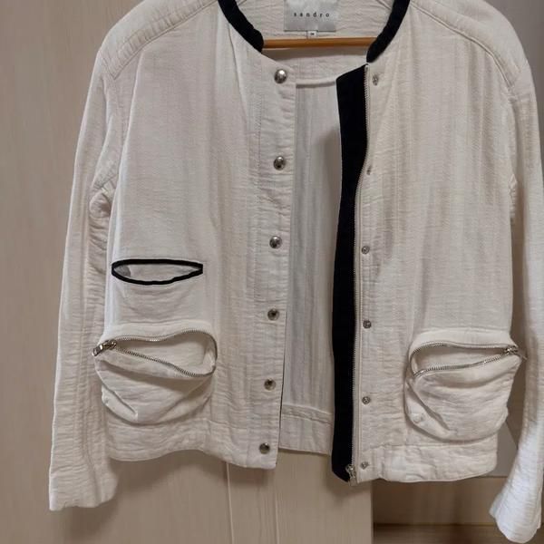 Iro Jacket (Category: Coats, Jackets and Outerwear) located in Singapore. Submitted by bunjangpartners (Listing ID 1463333839, Image 1). Description: Iro Jacket in white with a neat design that goes well with any outfit. It's a jacket that won't go out of style and can be worn for a long time. It has been stored for a while but has only been worn a few times, so it seems like it could fit a size 66. I tried it on because I'm a bit chubby, and it 