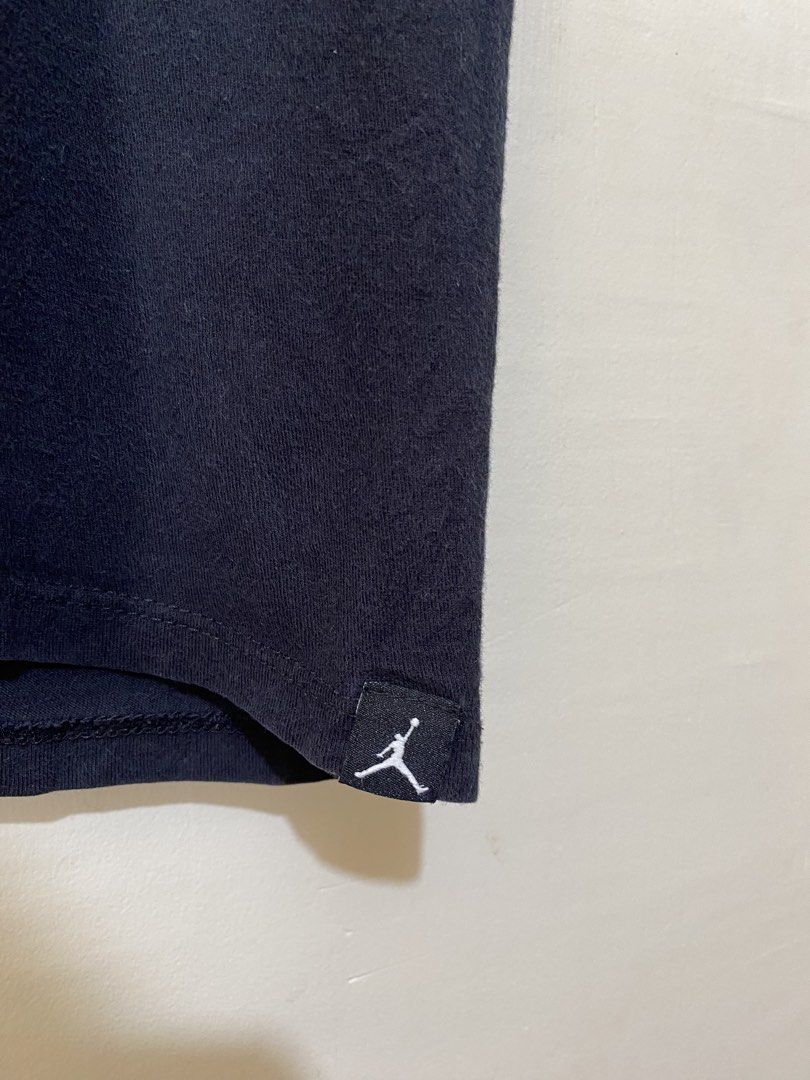 JORDAN, T-shirt (Category: Tshirts & Polo Shirts ) located in Cavite. Submitted by jc_thrift95 (Listing ID 1466100659, Image 3). Description: - a black cotton t-shirt with a small white striped chest logo and a subtle Jumpman tag on the hem. - Made in Mexico - L- 29 inch - W- 21 inch - Color rate 8/10 - See pictures details for dimes..