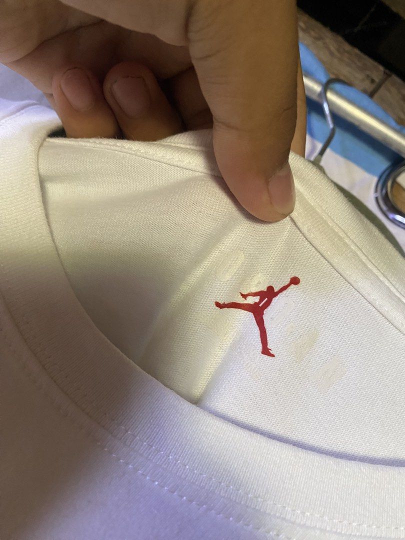 Jordan White Long Sleeve T-Shirt (Category: Tshirts & Polo Shirts ) located in Manila. Submitted by kentmarion.water (Listing ID 1465962563, Image 2). Description: White long sleeve t-shirt from Jordan. Large red Jumpman logo printed vertically on the front with Jordan branding. Smaller Jumpman logo on the left wrist. Crew neck design. 100% cotton material. Minor stain spot near the front chest area as pictured. Internal wash tags included..