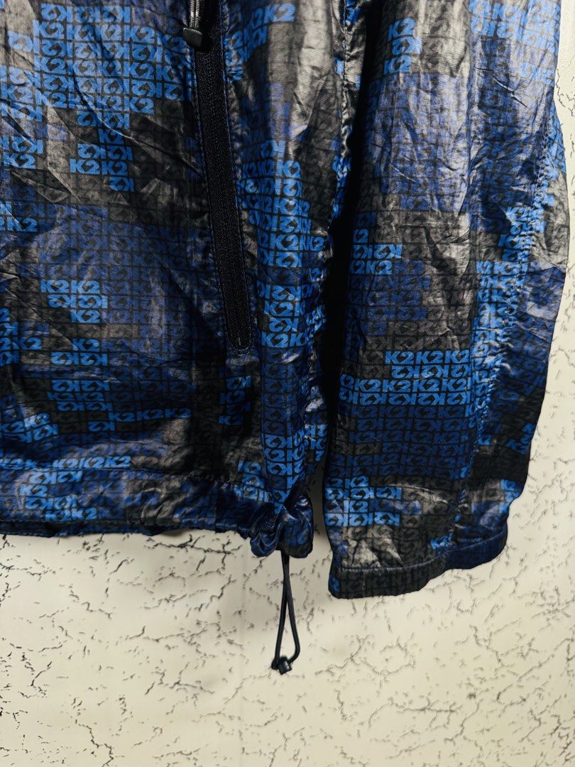 K2 Blue & Black Patterned Hooded Windbreaker Jacket Size 95 (Category: Coats, Jackets and Outerwear) located in Roxas City. Submitted by patsquarephantz (Listing ID 1466087077, Image 3). Description: - Brand/Model: K2 Hooded Jacket - Color/Design: Blue and black with all-over K2 pattern - Size: Korean 95 (fits like Medium) - Material: 100% lightweight polyester - Features: Full zip front, zippered side pockets, adjustable hood and hem drawstrings