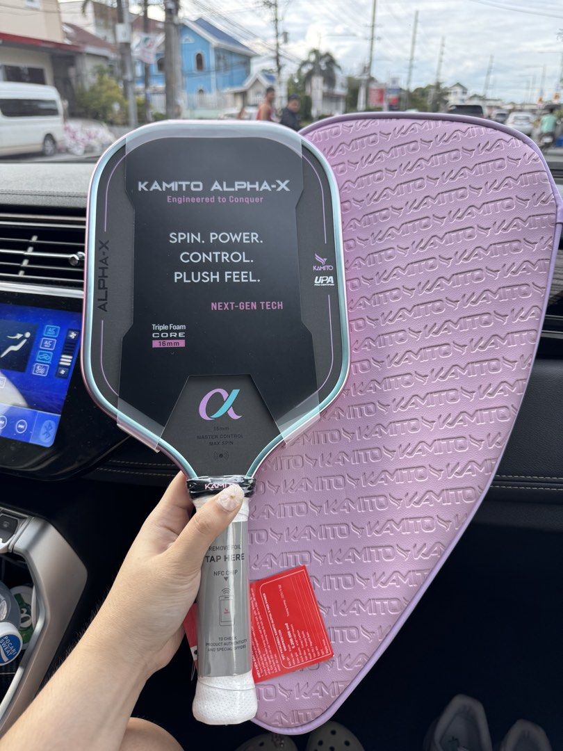 Kamito Alpha-X Pickleball Paddle with Cover (Category: Racket and Ball Sports) located in Manila. Submitted by lynettedec88739 (Listing ID 1466082494, Image 1). Description: - Brand: Kamito Alpha-X Paddle (16mm core with triple foam setup) - Performance: Engineered for maximum spin, power, control, and a plush feel - Condition: Brand new, plastic wrap still on the face, handle tags attached - Inclusions: Matching pink Kamito embossed cover and wa