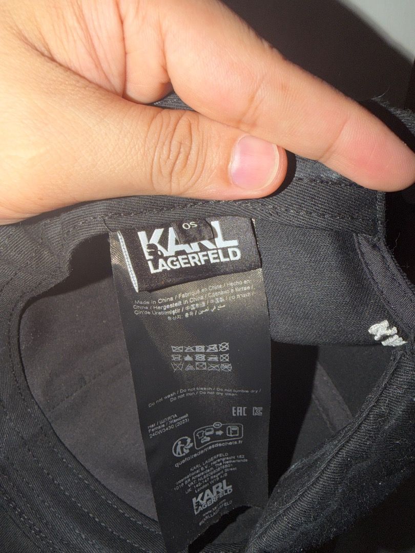 Karl Lagerfeld Black Baseball Cap with Iconic Patch (Category: Caps & Hats) located in Makati City. Submitted by limarhermis (Listing ID 1466144978, Image 3). Description: - Brand: Karl Lagerfeld - Color: Solid Black - Design: Signature cartoon patch on front panel - Structure: Classic curved brim and structured crown - Fit: Adjustable strap closure at the back - Condition: Clean and ready to wear - Style: Great everyday accessory for casual wear