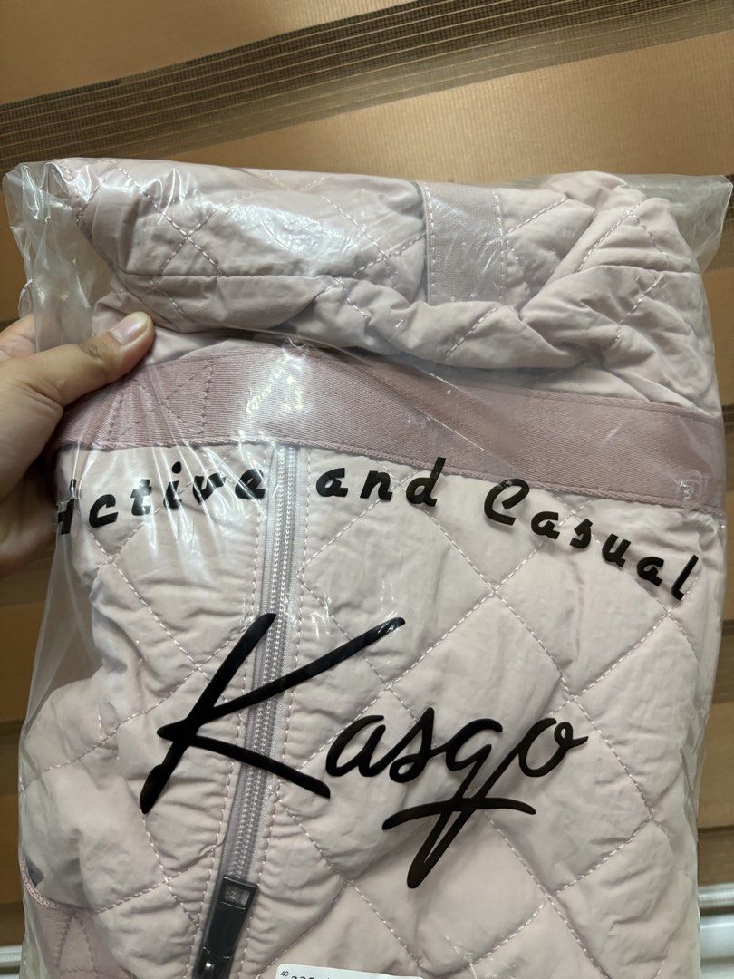 Kasgo Quilted Tote Bag Pink (Category: Tote Bags) located in Manila. Submitted by maemey_botique23 (Listing ID 1466081569, Image 1). Description: Kasgo quilted tote bag in light pink. Quilted nylon material with sturdy pink shoulder straps. Exterior zippered pocket on the front. Fully lined interior with multiple compartments, padded laptop sleeve, and a matching small quilted pouch included. Zipper closure on top. Brand new in original plastic p