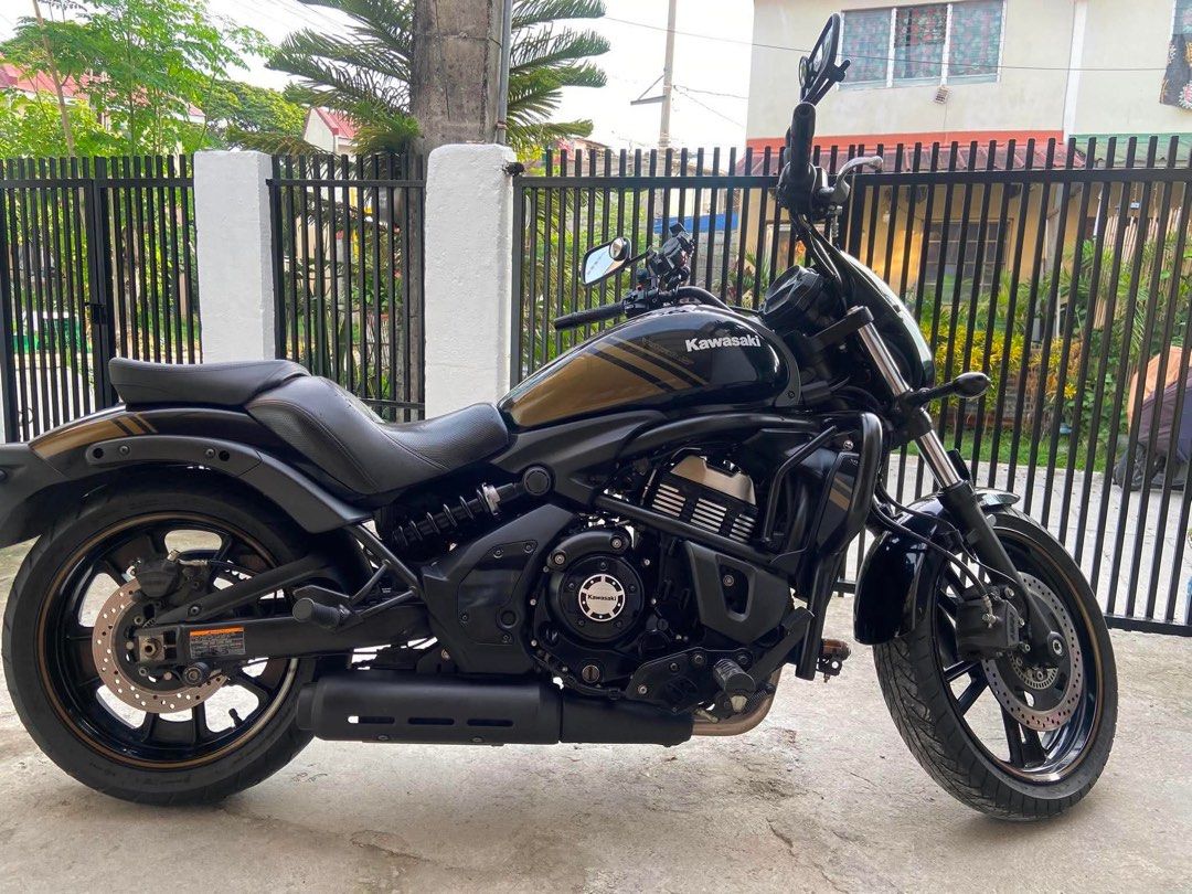 Kawasaki Vulcan S ABS Cruiser Motorcycle (Category: Motorbikes for Sale) located in Manila. Submitted by 9ecamsanto32077 (Listing ID 1466065327, Image 2). Description: Kawasaki Vulcan S cruiser motorcycle. Black and gold paint scheme with matching striped accents on the tank, fenders, and wheels. Equipped with ABS brakes, front crash bars, black exhaust pipe, and a small windshield cowl. Comfortable contoured seat setup. Clean bike overall, ready