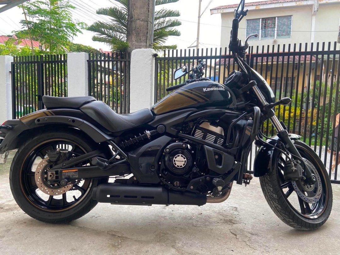 Kawasaki Vulcan S ABS Cruiser Motorcycle (Category: Motorbikes for Sale) located in Manila. Submitted by 9ecamsanto32077 (Listing ID 1466065327, Image 1). Description: Kawasaki Vulcan S cruiser motorcycle. Black and gold paint scheme with matching striped accents on the tank, fenders, and wheels. Equipped with ABS brakes, front crash bars, black exhaust pipe, and a small windshield cowl. Comfortable contoured seat setup. Clean bike overall, ready