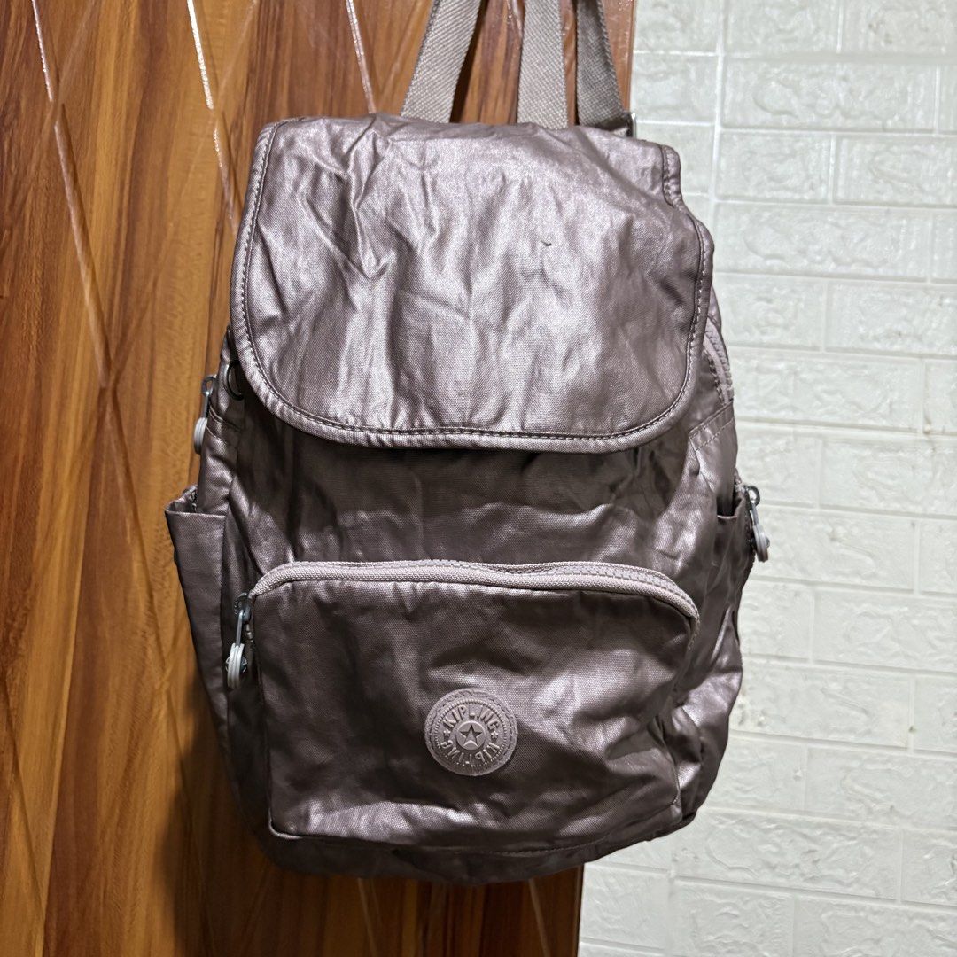 Kipling Metallic Grey Flap Backpack (Category: Backpacks) located in Carmen. Submitted by rr_thrifts (Listing ID 1466033153, Image 2). Description: .
