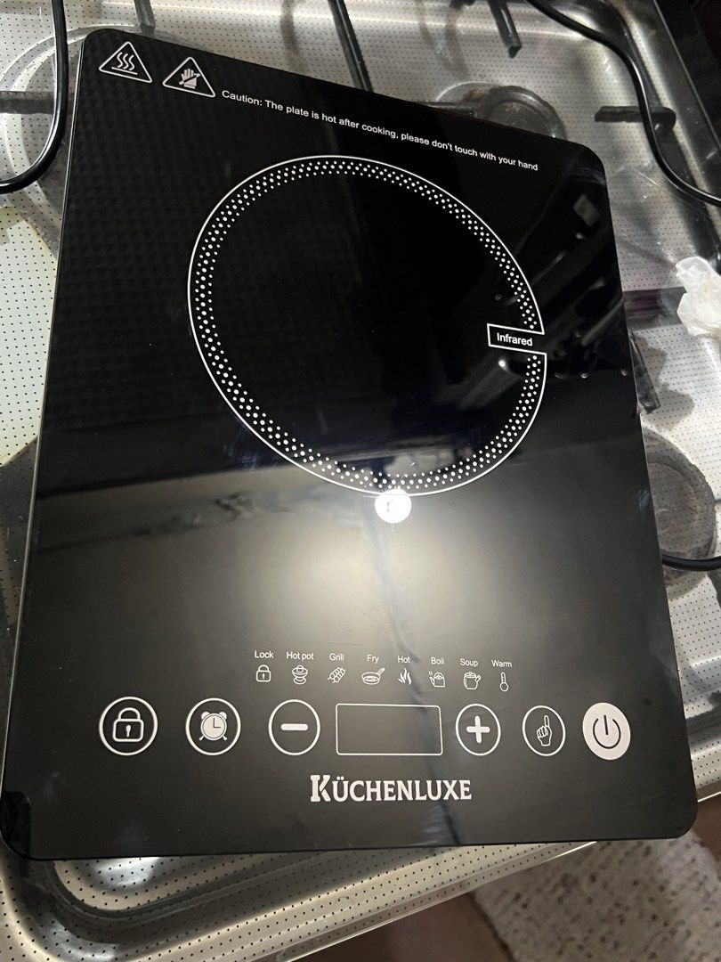 Kuchenluxe Induction Cooker (Category: Cookware & Accessories) located in Makati City. Submitted by doll4real (Listing ID 1465962931, Image 2). Description: Used once! Bought at S&R for ₱2,200 - KuchenLuxe Infrared Cooker (Model KFric-2) - Polished crystal glass plate - Adjustable temperature control - 6 Cooking Settings: Hot Pot, Grill, Fry, Hot, Boil, Soup, Warm - Child-lock safety feature - High heating efficiency - Sleek and modern design - C