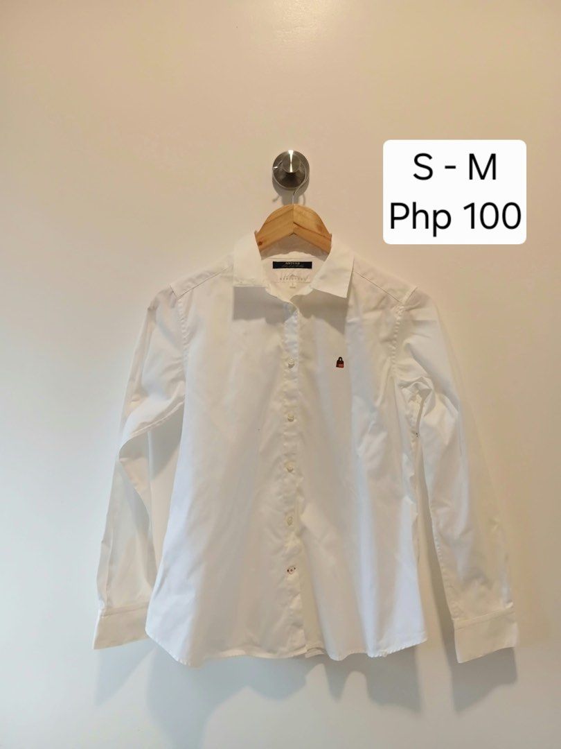 Kumikyoku White Button-Down Shirt Size 3 (Category: Shirts) located in Antipolo. Submitted by wisecat.4a7eea (Listing ID 1466041332, Image 1). Description: - Brand: Kumikyoku (Anteks fabric) - Color: Classic White - Style: Long-sleeve button-down with classic collar and button cuffs - Details: Cute small embroidered bag logo on the chest - Size: Size 3 (fits Small to Medium) - Condition: Clean and well-maintained - Perfect for: Office wear or cas