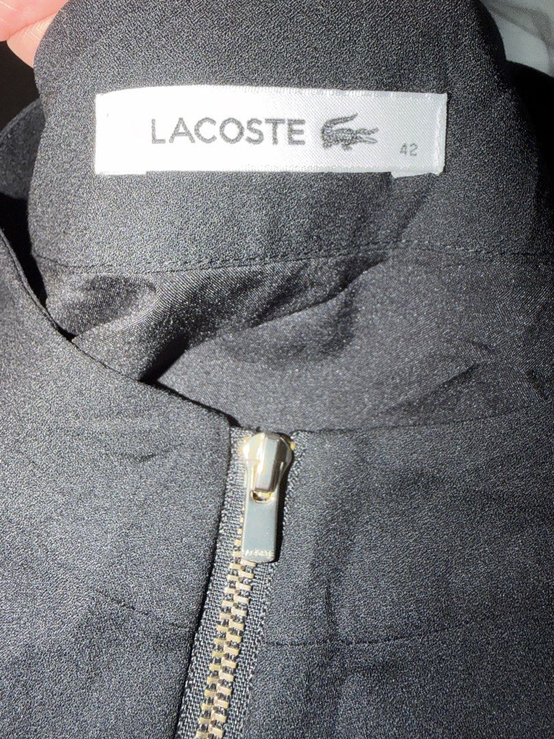 Lacoste Black Zip-Front Dress Size 42 (Category: Dresses) located in Quezon City. Submitted by frincezz19 (Listing ID 1466092920, Image 2). Description: - Brand: Lacoste - Color: Black - Style: Short sleeve dress with front zipper closure - Features: Two front side pockets - Material: 100% polyester - Size: 42 (tag attached at collar) - Condition: Excellent.