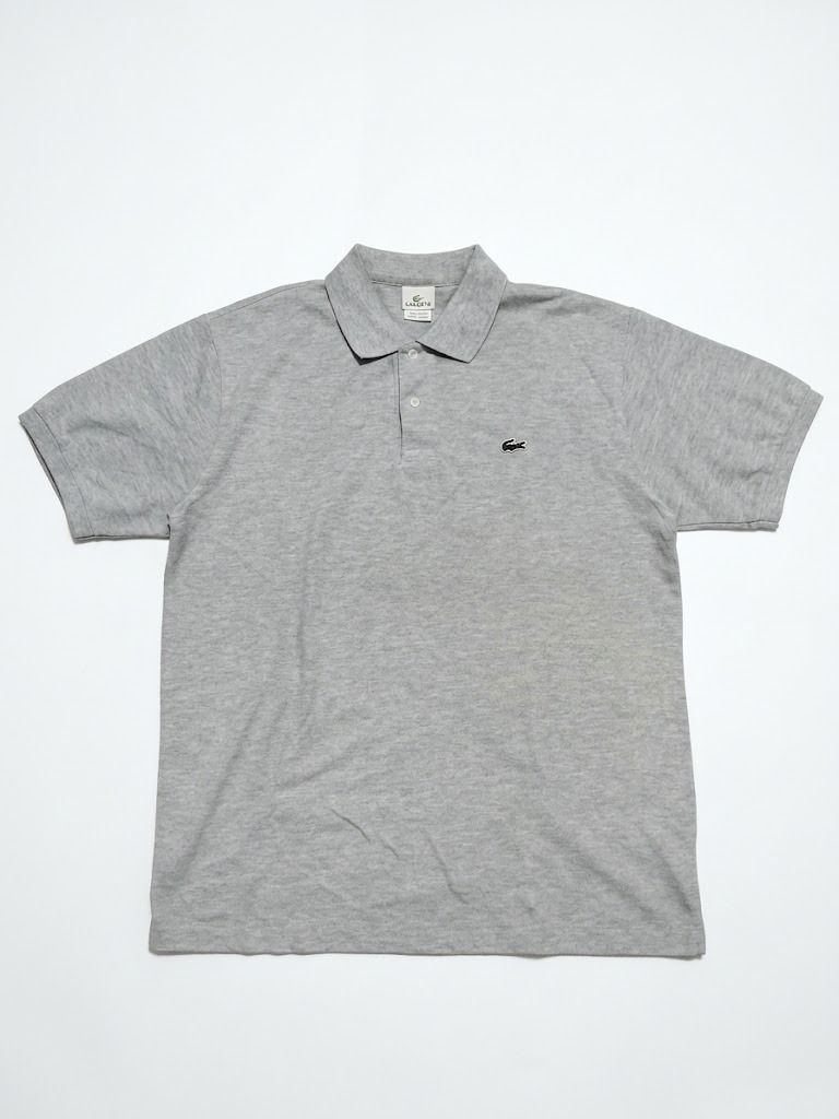 Lacoste Grey Polo Shirt (Category: Tshirts & Polo Shirts ) located in Caloocan City. Submitted by silverdragon_aaed38 (Listing ID 1466108252, Image 1). Description: -Lacoste Classic Grey - Complete tags - Size 7 / XL - Dimes W23/23.5 L29/30 - Color Rate 10 - No issue - Style: Short sleeves, classic collar, two pearl buttons - Detail: Small black embroidered crocodile logo on the left chest - Fit: Ribbed cuffs and hem for a comfortable fit - Condi