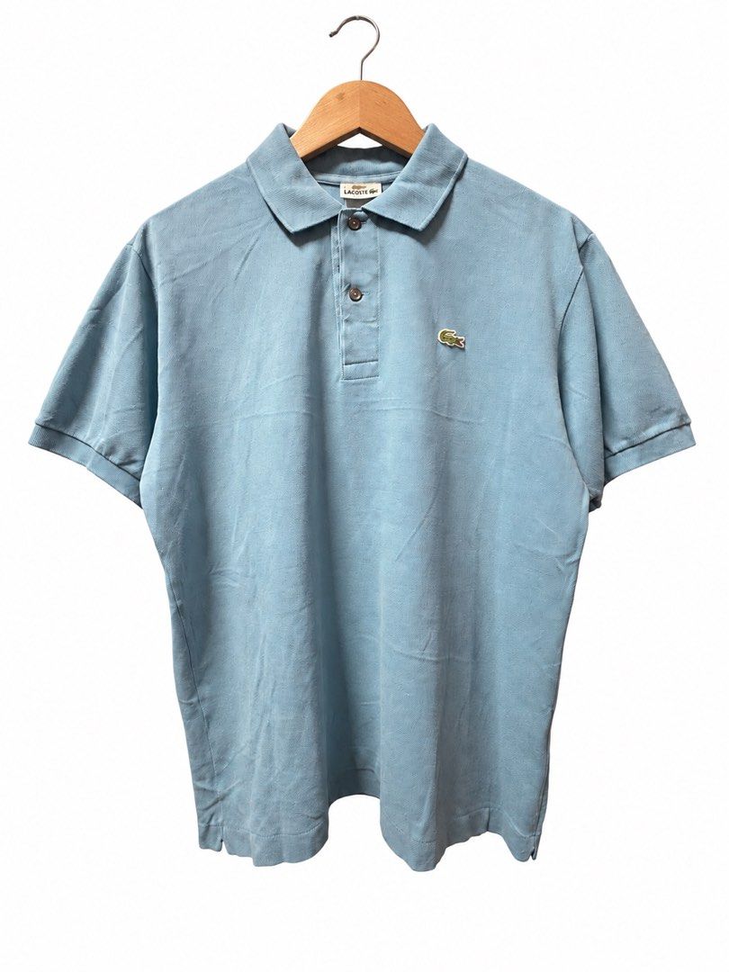 Lacoste Light Blue Polo Shirt Size 4 / M (Category: Tshirts & Polo Shirts ) located in Tangub. Submitted by laurbepena33002 (Listing ID 1465955455, Image 1). Description: - Brand: Lacoste - Color: Light Blue - Size: 4 (Fits AU Medium) -Dimension: W22”xL25.5” - Material: Classic cotton petit pique knit - Features: Traditional two-button placket with dark buttons and signature embroidered green crocodile logo - Condition: Clean interior neck tags a