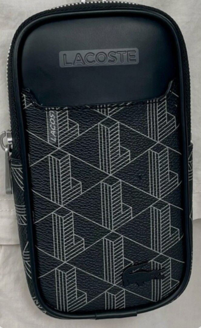 Lacoste Monogram Print Neck Phone Pouch Black (Category: Sling Bags) located in Marikina City. Submitted by kkyoshino (Listing ID 1466140113, Image 1). Description: Original Lacoste leather necklaceohone pouch bag.. Bought from Lacoste store 7K.. selling it for 4,000 pesos only.. like new.. no issues. used 3 times only.. .