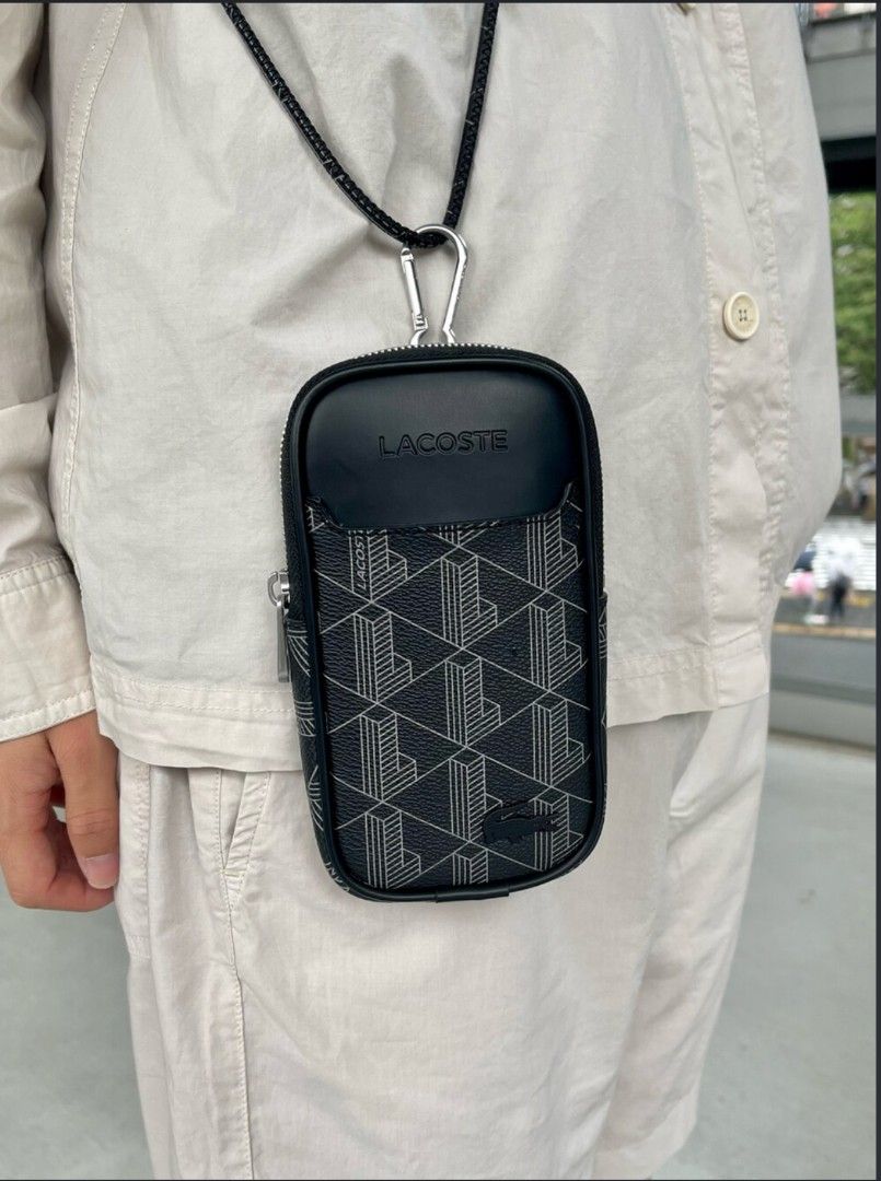 Lacoste Monogram Print Neck Phone Pouch Black (Category: Sling Bags) located in Marikina City. Submitted by kkyoshino (Listing ID 1466140113, Image 2). Description: Original Lacoste leather necklaceohone pouch bag.. Bought from Lacoste store 7K.. selling it for 4,000 pesos only.. like new.. no issues. used 3 times only.. .