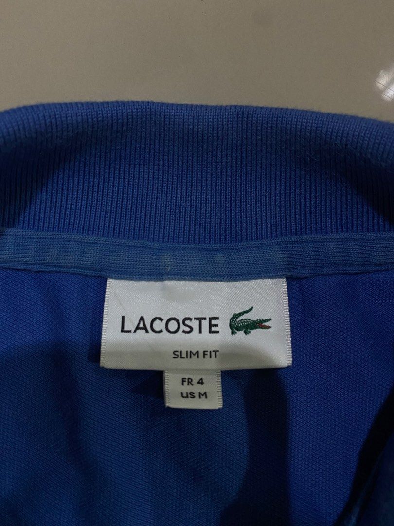 Lacoste Polo shirt (Category: Coats, Jackets and Outerwear) located in Nagcarlan. Submitted by nsh.c (Listing ID 1465968419, Image 3). Description: Excellent condition Cr:9.5/10 Dimes:25X19.5 No issue.