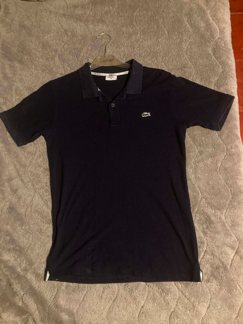 Lacoste polo shirt (Category: Luxury Apparel) located in Bulacan. Submitted by foundnfold (Listing ID 1466071812, Image 1). Description: Lacoste polo shirt (off) COLOR: NAVY BLUE SIZE: MEDIUM ON TAG LENGTH: 28 WIDTH: 20 COLOR RATE: 9/10 CONDITION: 9/10.