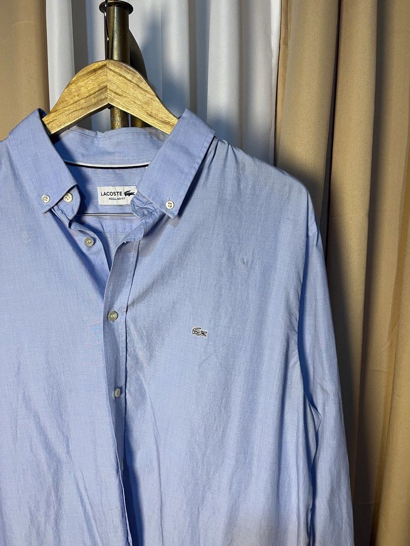 Lacoste Regular Fit Light Blue Long Sleeve Button-Down Shirt (Category: Formal Shirts) located in Kidapawan. Submitted by azythrift (Listing ID 1466049752, Image 3). Description: - Brand: Lacoste - Color: Light blue - Size: US 17 1/2 / FR 44 (Regular Fit) - Details: Button-down collar, front placket, buttoned cuffs - Logo: Iconic embroidered green crocodile on left chest - Condition: Clean, classic, and ready to wear - Style: Great for office wea