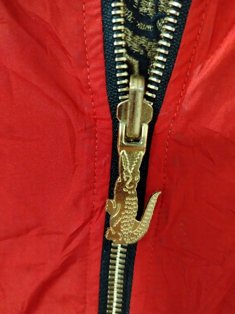 Lacoste Reversible Bomber Jacket Red Black Embroidered Fortune (Category: Coats, Jackets and Outerwear) located in Manila. Submitted by okellorrai95403 (Listing ID 1465981387, Image 2). Description: - Style: Reversible bomber jacket (Red/Black patterned side & Solid Black reverse side) - Details: Custom zipper pull, embroidered chest and sleeve patches - Statement Piece: Large embroidered 'Fortune' dragon graphic on the back of the black side - C