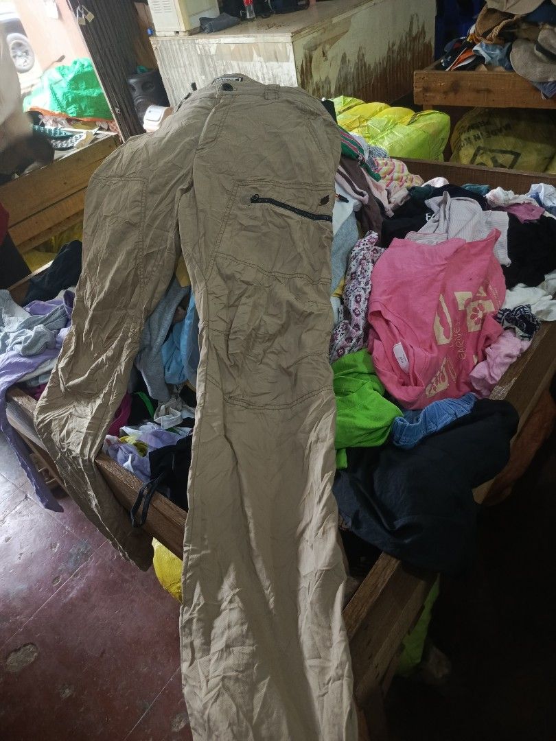 Lafuma Khaki Cargo Pants Size 78-91 (Category: Trousers) located in City of Isabela. Submitted by warmbird.d06e6f (Listing ID 1466036194, Image 1). Description: - Brand: Lafuma - Color: Khaki - Size: 78-91 - Material: Comfortable blend of cotton, nylon, and polyurethane - Design: Outdoor utility style with a zippered thigh pocket and high-visibility orange pull cord - Detail: Stylish orange accent stitching inside the waistband.