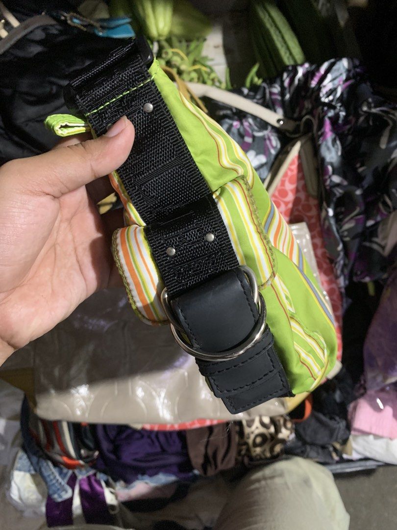 Lauren Ralph Green Striped Shoulder Bag (Category: Shoulder Bags) located in Manila. Submitted by thriftnivee (Listing ID 1466099882, Image 3). Description: - Authentic Lauren Ralph Lauren shoulder bag in a vibrant bright green - Features eye-catching vertical stripes in orange, yellow, and blue - Comfortable black fabric strap with chic silver hardware rings - Secure zip top closure for daily essentials - Black-lined interior equipped with multi