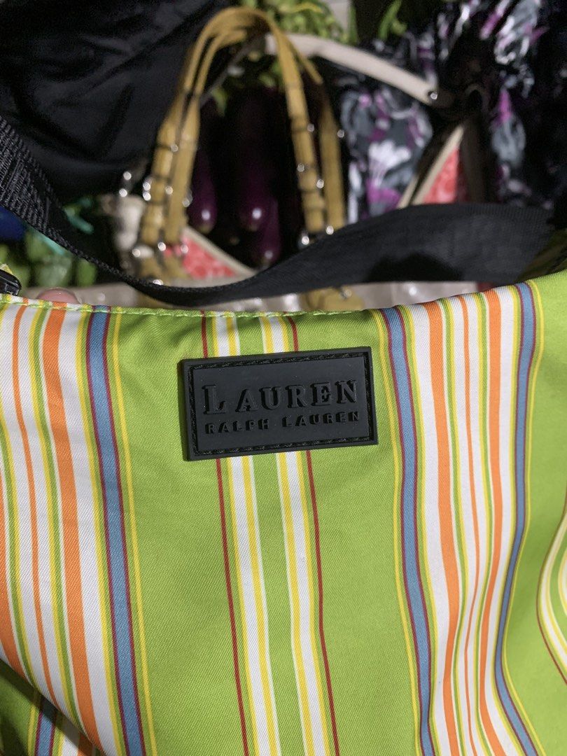 Lauren Ralph Green Striped Shoulder Bag (Category: Shoulder Bags) located in Manila. Submitted by thriftnivee (Listing ID 1466099882, Image 2). Description: - Authentic Lauren Ralph Lauren shoulder bag in a vibrant bright green - Features eye-catching vertical stripes in orange, yellow, and blue - Comfortable black fabric strap with chic silver hardware rings - Secure zip top closure for daily essentials - Black-lined interior equipped with multi