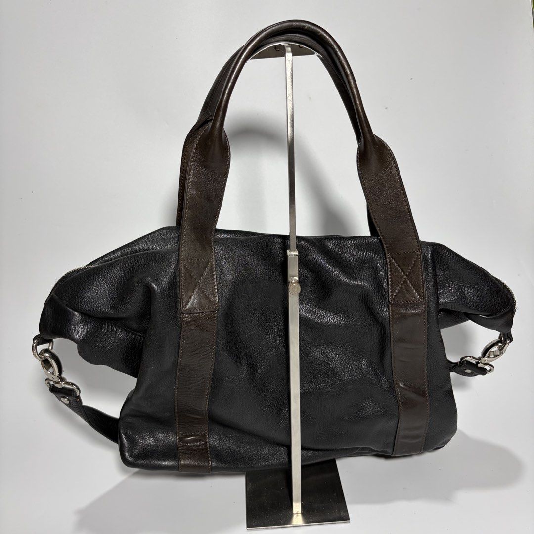 Leather japan Shoulder Bag Handbag 2Way (Category: Shoulder Bags) located in Magalang. Submitted by luxgood18 (Listing ID 1466125247, Image 2). Description: Materials: The main body is crafted from a soft, heavily grained pebbled black leather Lining fabric: Fully lined with a bold, high-contrast black and cream vertical stripe print fabric featuring a soft satin or twill finish. .
