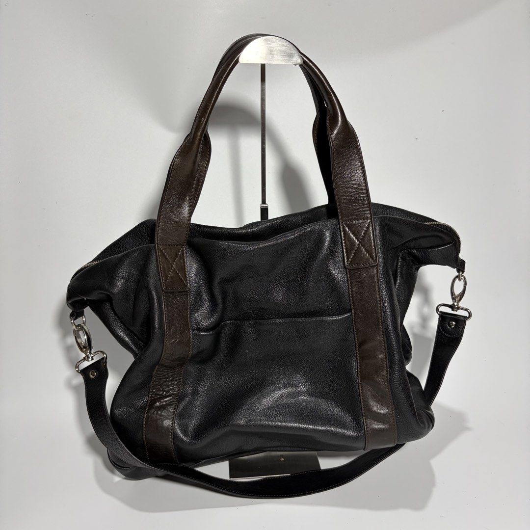 Leather japan Shoulder Bag Handbag 2Way (Category: Shoulder Bags) located in Magalang. Submitted by luxgood18 (Listing ID 1466125247, Image 1). Description: Materials: The main body is crafted from a soft, heavily grained pebbled black leather Lining fabric: Fully lined with a bold, high-contrast black and cream vertical stripe print fabric featuring a soft satin or twill finish. .