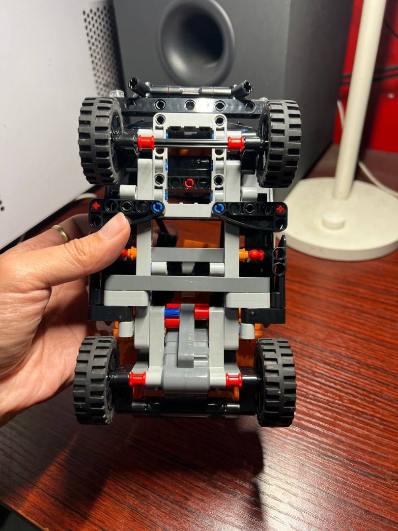 LEGO Technic NEOM McLaren Extreme E Car (Category: Lego & Building Sets) located in Baguio. Submitted by ditoyzb08176 (Listing ID 1466095332, Image 3). Description: - Model: Fully assembled black and orange LEGO Technic off-road vehicle - Details: Features authentic NEOM, McLaren, and Continental sponsor stickers - Wheels: Equipped with chunky rubber tires with a detailed tread pattern - Condition: Built model, exactly as pictured - Ideal For: Gr