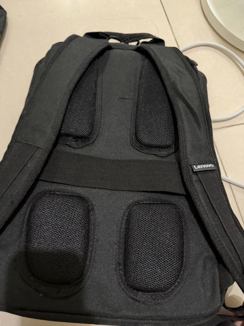 Lenovo black and blue laptop backpack (Category: Backpacks) located in Makati City. Submitted by japaneseshop (Listing ID 1466108955, Image 2). Description: - Color: Sleek black with stylish blue accents - Comfort: Padded mesh back panels for all-day carrying comfort - Straps: Adjustable shoulder straps featuring a Lenovo branding tag on the right strap - Convenience: Sturdy top handle for easy grab-and-go - Capacity: Fits laptops and your daily 