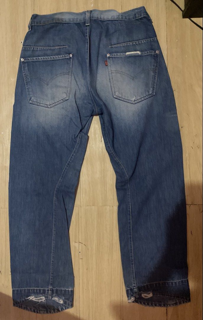 Levi's 32x30 Blue Jeans (Category: Jeans) located in Tanauan. Submitted by rie098 (Listing ID 1466023285, Image 2). Description: - Brand: Levi's - Size: 32x30 - Wash: Blue wash - Fit: Regular fit with button fly and belt loops - Details: Unique paneling on front and back legs - Distressing: Distressed details at both hems and right back pocket - Origin: Made in Tunisia - Condition: Great everyday pair.