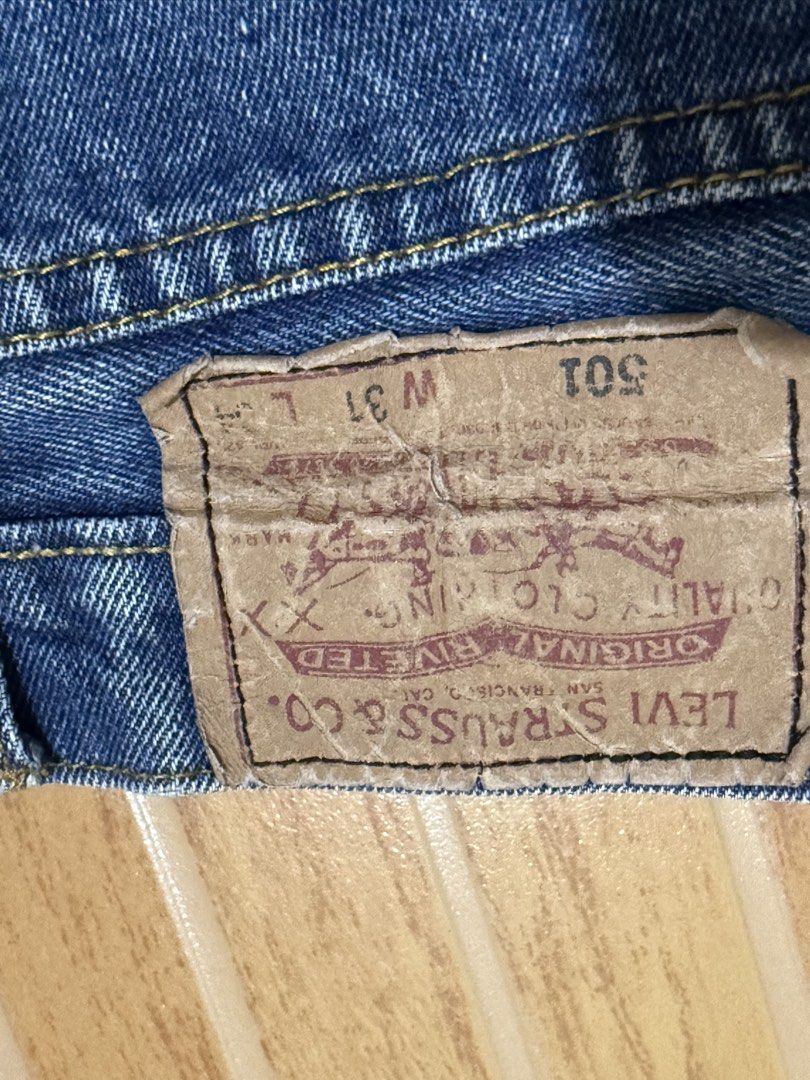 Levi's 501 Blue Jeans Size W31 (Category: Jeans) located in Mandaluyong City. Submitted by kickin_it_thrift (Listing ID 1466021812, Image 2). Description: - Brand: Levi's 501 - Color: Classic Blue Denim - Size: W31 - Fit: Standard straight leg - Details: Button fly, 5-pocket styling, contrast yellow stitching - Authenticity: Leather back patch and interior care tags (Made in Vietnam) - Condition: Ready for everyday wear.