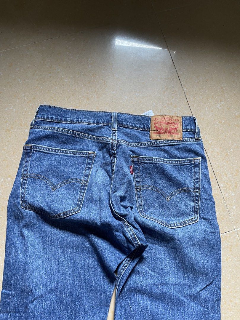 Levi's 505 Regular Fit Jeans W31 L32 (Category: Jeans) located in Davao. Submitted by loythrift30 (Listing ID 1466046928, Image 3). Description: - Brand: Levi's 505 Regular Fit - Color: Medium blue wash - Size: W31 L32 - Fit: Classic straight leg with five-pocket styling and zip fly - Details: Iconic leather back patch and red tab on pocket.