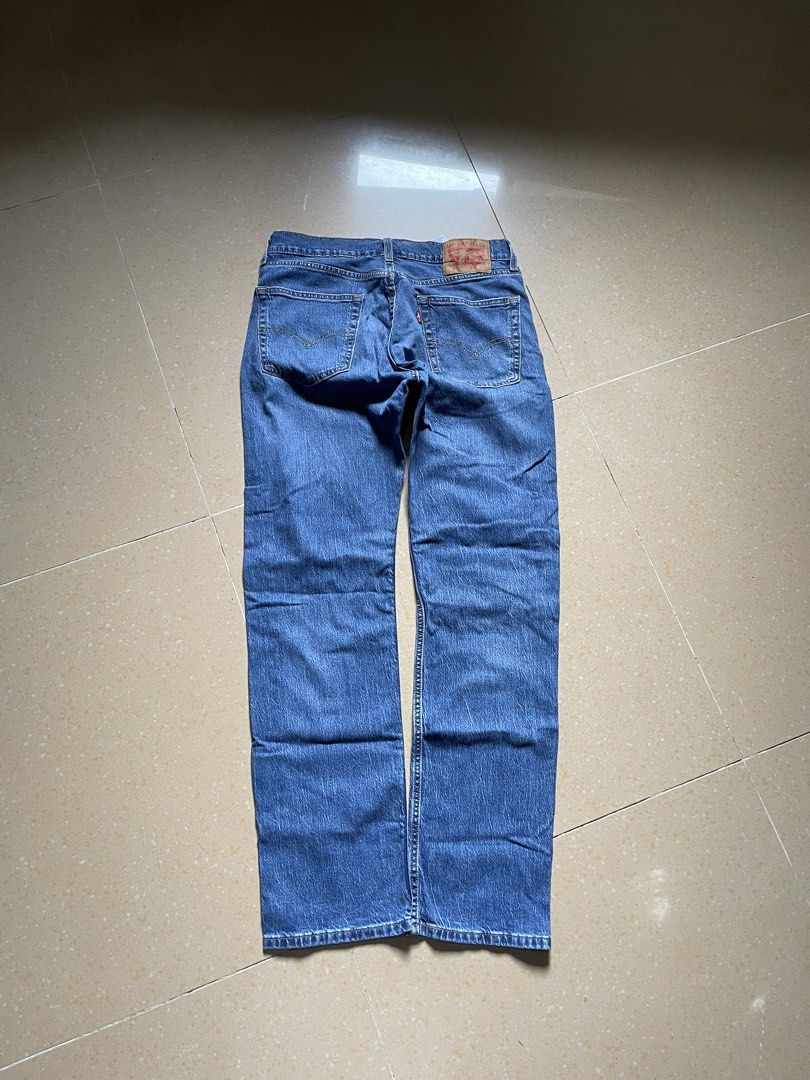 Levi's 505 Regular Fit Jeans W31 L32 (Category: Jeans) located in Davao. Submitted by loythrift30 (Listing ID 1466046928, Image 2). Description: - Brand: Levi's 505 Regular Fit - Color: Medium blue wash - Size: W31 L32 - Fit: Classic straight leg with five-pocket styling and zip fly - Details: Iconic leather back patch and red tab on pocket.