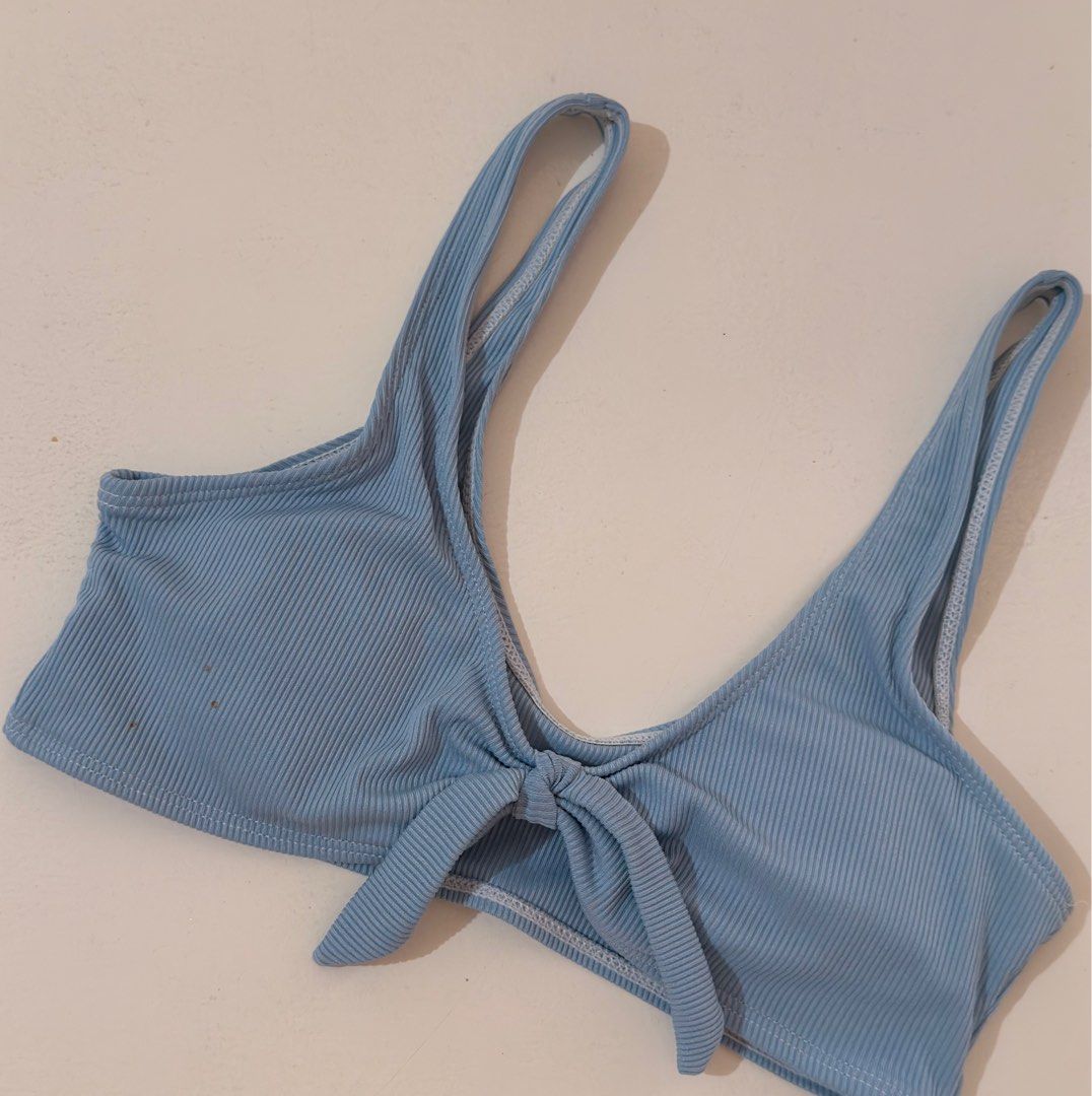 Light blue ribbed bikini top with front knot detail (Category: Bikinis & Swimsuits) located in Cebu City. Submitted by softly.preloved (Listing ID 1466149143, Image 2). Description: - light blue ribbed fabric - cute center front knot tie - condition: good, with a few tiny brown spots near the top left corner (kindly check last photo) .