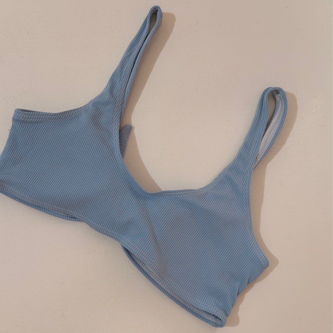 Light blue ribbed bikini top with front knot detail (Category: Bikinis & Swimsuits) located in Cebu City. Submitted by softly.preloved (Listing ID 1466149143, Image 3). Description: - light blue ribbed fabric - cute center front knot tie - condition: good, with a few tiny brown spots near the top left corner (kindly check last photo) .