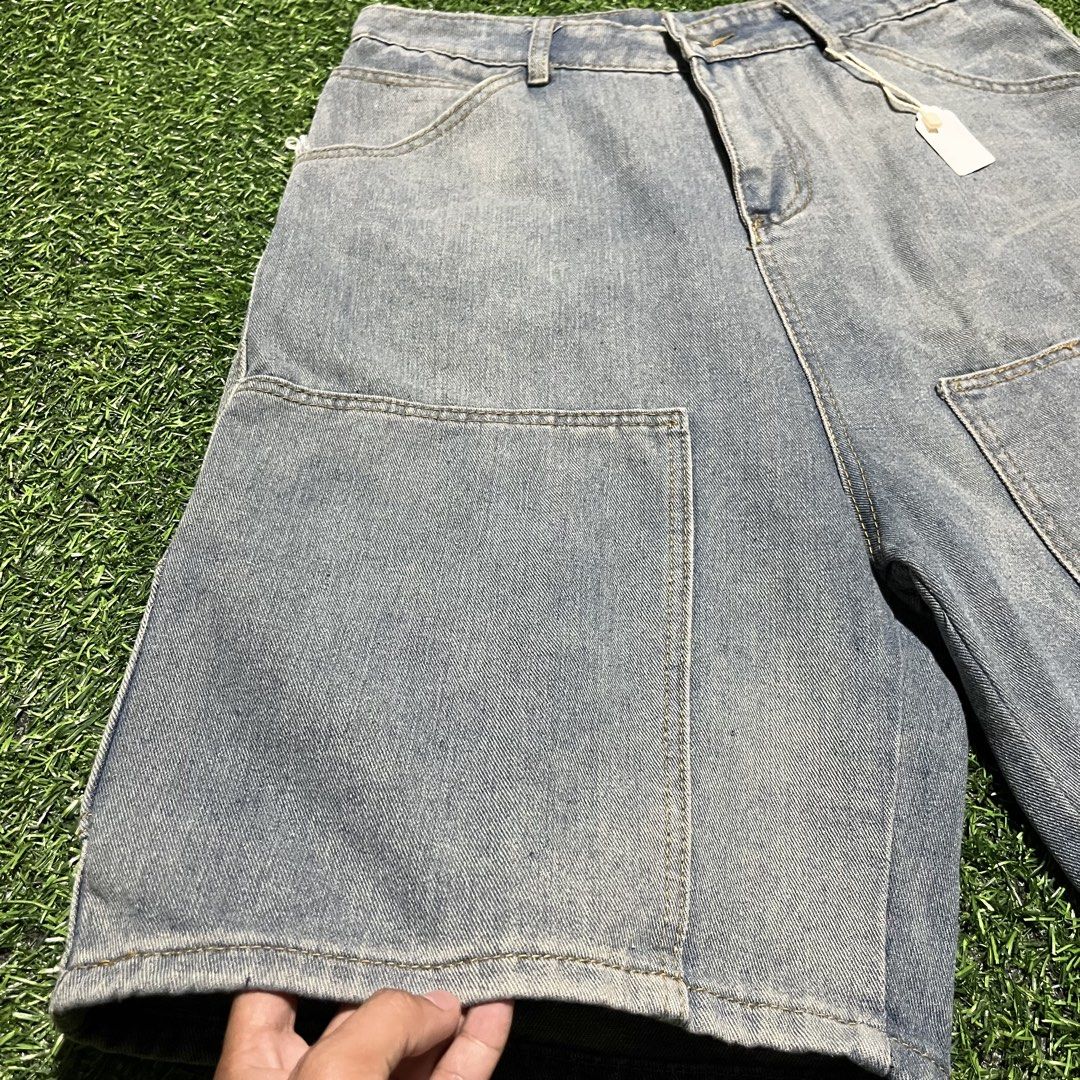 Light wash denim jorts with utility pockets (Category: Shorts) located in Argao. Submitted by secondcyclecollection (Listing ID 1465961364, Image 3). Description: - Brand new with tags still attached - Light wash denim in a classic carpenter style - Functional large utility pockets on front and back - Small woven brand patch on lower left leg - Button fly closure and belt loops.