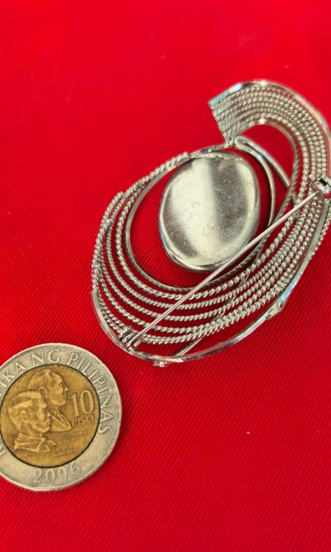 Like new Japan brooch (Category: Brooches) located in Tuguegarao City. Submitted by zenphoenix-7ad615 (Listing ID 1466021788, Image 2). Description: Silver color brooch.