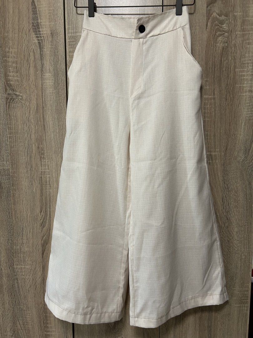 Linen-Style Wide-Leg Pants (Category: Other Bottoms) located in Bulacan. Submitted by relove.re (Listing ID 1465960519, Image 1). Description: Size: XS to S (petite) Condition: Pre-loved / Good condition Color: Off-white / Cream Style: High-waist, wide-leg / culotte style Details: Button closure • Side pockets • Relaxed fit.
