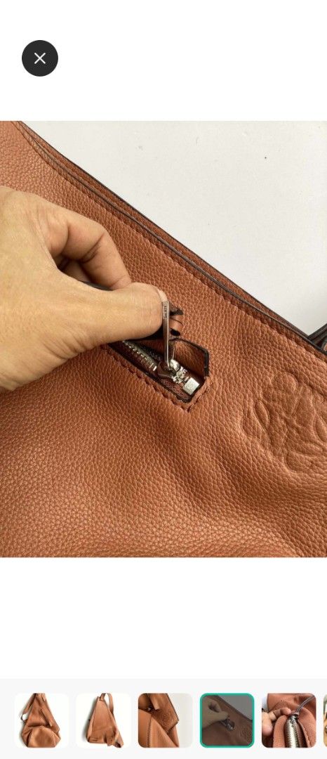 Loewe Heel Backpack Tan Leather (Category: Backpacks) located in Manila. Submitted by cosmicmoon.2871 (Listing ID 1465988281, Image 1). Description: - Brand: Loewe - Color: Tan Brown - Material: Premium pebble leather with light beige herringbone textile lining - Design: Unique triangular silhouette with adjustable single shoulder strap - Branding: Embossed Anagram logo on the corner - Closure: Zip closure with silver-tone hardware and leather pu