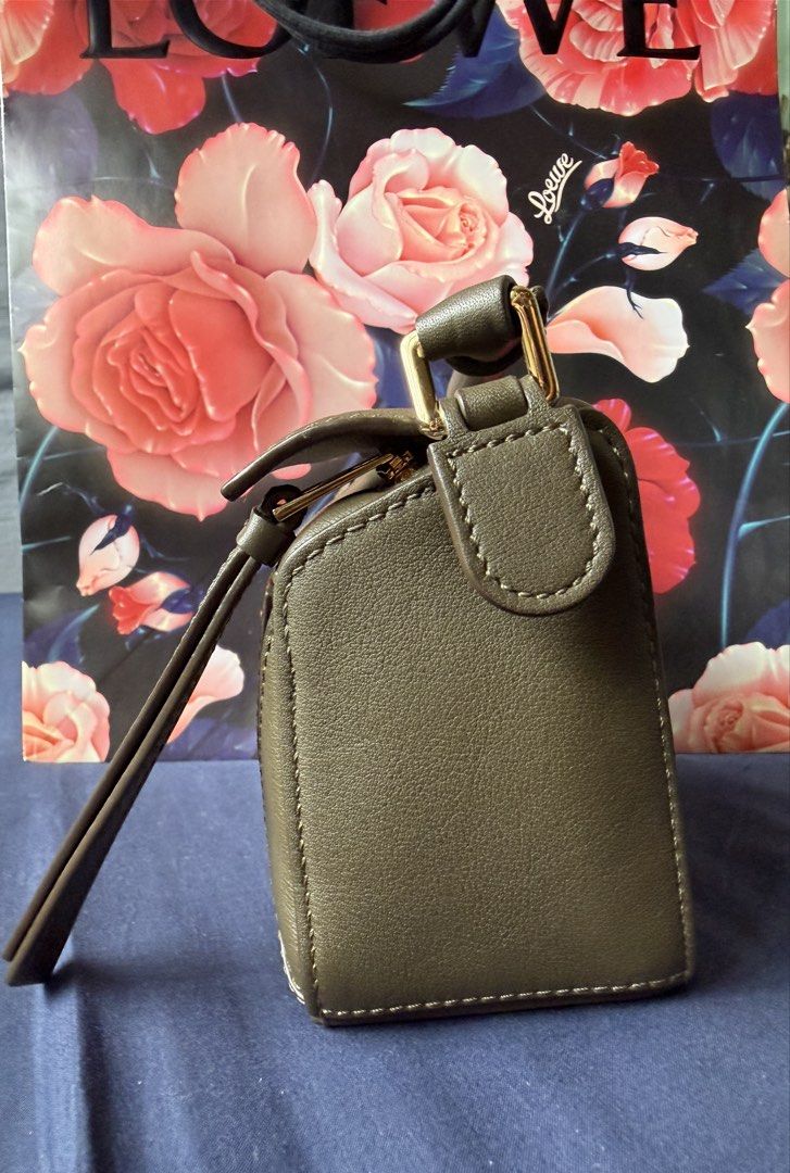 Loewe Mini Puzzle Bag (Complete Set w/ receipt) (Category: Luxury Bags & Wallets) located in Talisay. Submitted by justgeeeee (Listing ID 1465981583, Image 3). Description: IF VERY INTERESTED: I CAN SEND YOU A VIDEO OF THE ITEM BOUGHT IN GREENBELT3 - COMPLETE SET (Store receipt, price tag, care cards, dust bag, box, paper bag) - Authentic Loewe Puzzle Bag in versatile olive green leather - Distinct geometric panel construction with embossed Anagr