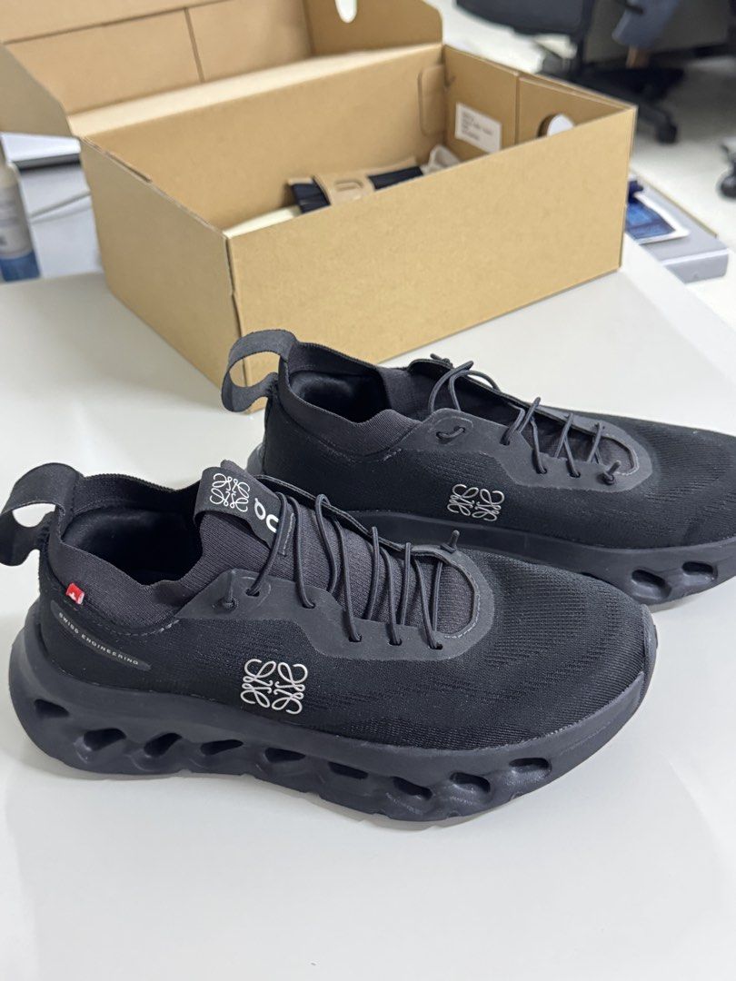 Loewe x On Cloudtilt All Black Size 37 (Category: Sneakers & Footwear) located in Pasig City. Submitted by juwlgaga (Listing ID 1466033496, Image 1). Description: - Brand: Loewe x On Cloudtilt - Color: All Black - Size: EU 37 - Condition: Brand new, unworn - Design: Super comfortable slip-on with iconic hollowed-out sole - Inclusions: Complete with original box, dust bags, extra laces, and cards.