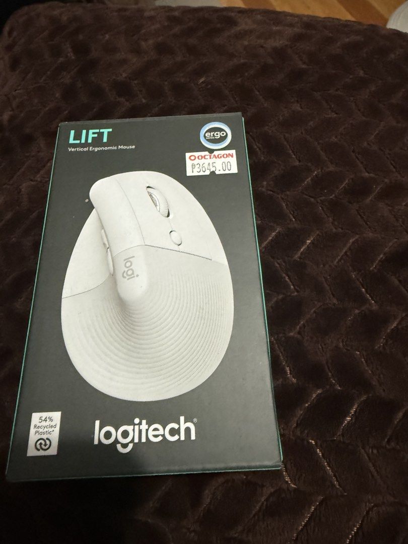 Logitech Lift Vertical Ergonomic Mouse (Category: Mouse & Mousepads) located in Makati City. Submitted by anjelaaaah (Listing ID 1465991325, Image 1). Description: - Product: Logitech Lift Vertical Ergonomic Mouse - Color: Off-white / Pale Grey - Condition: Open-box (taken out for photos only, brand new feel) - Inclusions: Original retail box with Octagon price tag attached - Key Features: Promotes natural handshake position to reduce wrist strai