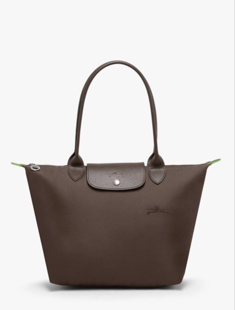 Longchamp Le Pliage Green Series in Mocha (Medium, Long Handle) (Category: Luxury Bags & Wallets) located in Makati City. Submitted by shoppinggal88 (Listing ID 1466114849, Image 1). Description: - Model: Longchamp Le Pliage Green Series in MOCHA - Size: Medium w Long Handles - Color: Solid dark brown with contrast neon green zipper details - Material: Durable nylon body with matching leather handles and flap - Closure: Secure zip top with silver