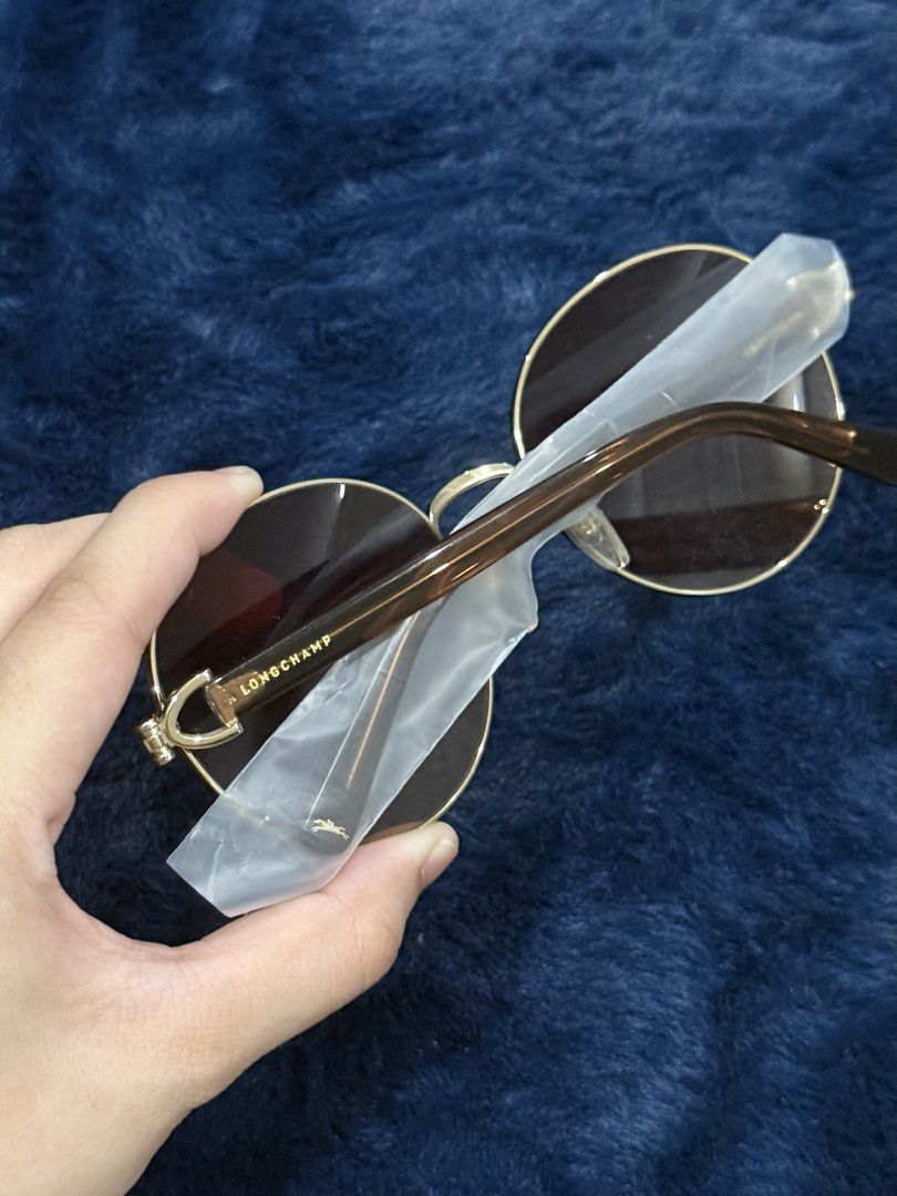 Longchamp Round Sunglasses Gold Brown (Category: Sunglasses & Eyewear) located in Manila. Submitted by snowflakesi (Listing ID 1465970144, Image 2). Description: - Style: Oversized round statement sunglasses - Frame: Gold-tone metal - Lenses: Gradient brown - Arms: Brown acetate with gold Longchamp lettering and horse logo Helping my ninang sell authentic sunglasses. ☀️ .