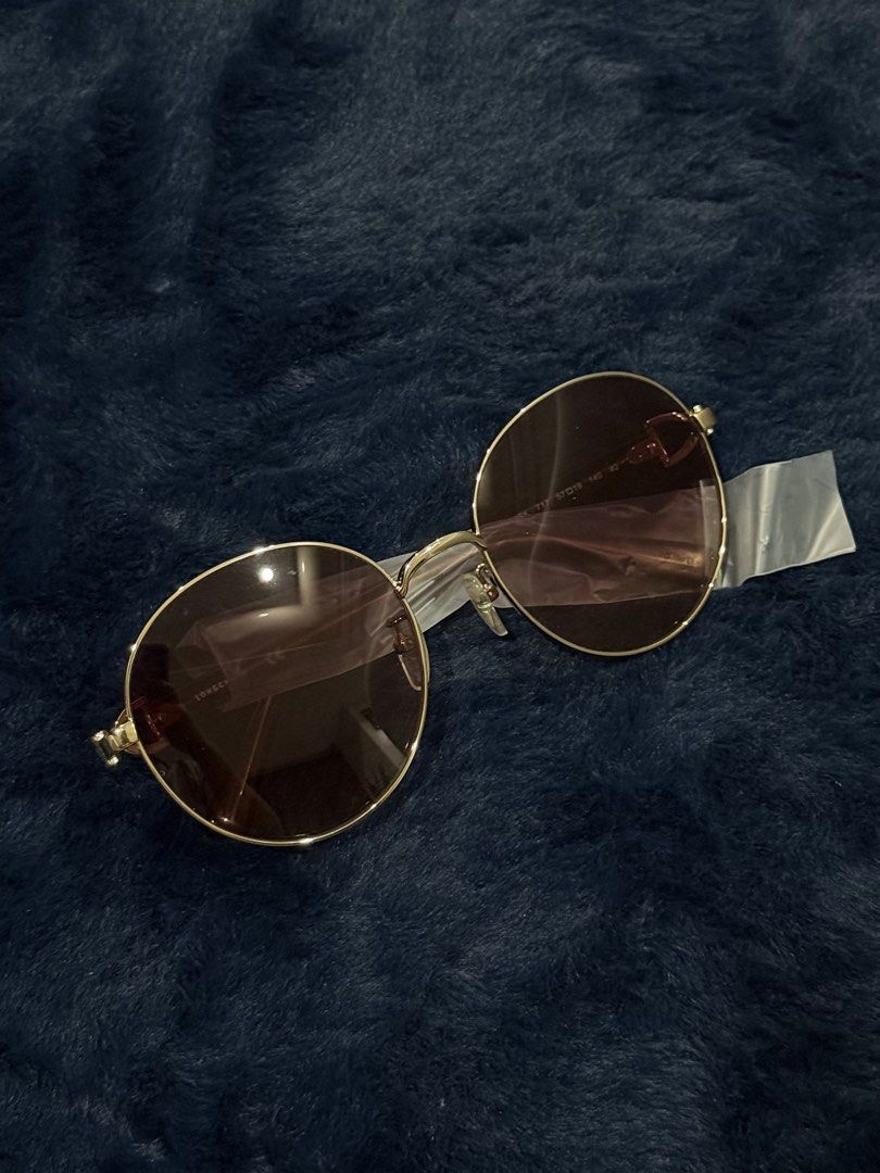Longchamp Round Sunglasses Gold Brown (Category: Sunglasses & Eyewear) located in Manila. Submitted by snowflakesi (Listing ID 1465970144, Image 1). Description: - Style: Oversized round statement sunglasses - Frame: Gold-tone metal - Lenses: Gradient brown - Arms: Brown acetate with gold Longchamp lettering and horse logo Helping my ninang sell authentic sunglasses. ☀️ .