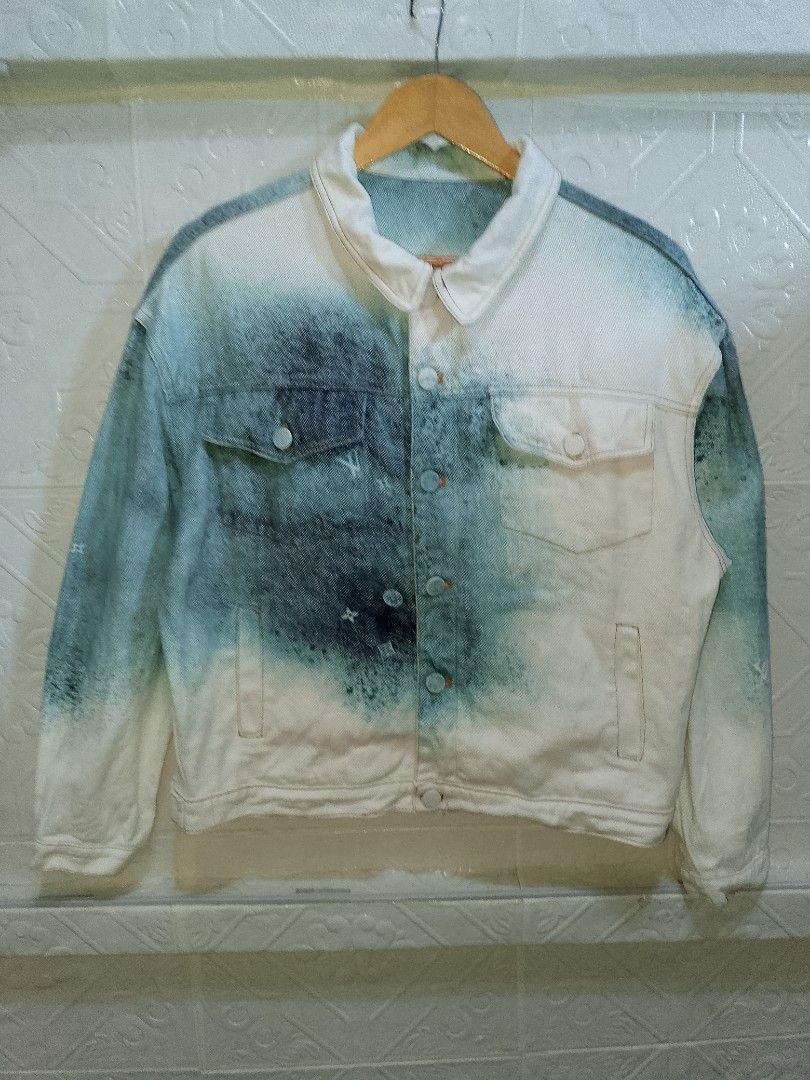 Louis Vuitton Bleached Denim Jacket Monogram Size M (Category: Coats, Jackets and Outerwear) located in Manila. Submitted by mjthrifted_second (Listing ID 1466041804, Image 1). Description: - Brand: Louis Vuitton - Size: Medium (relaxed fit) - Color/Wash: Bleached blue and white - Details: Monogram pattern, paint splatter effect, brown leather LV back hem patch - Pockets: Dual chest flap pockets and side welt pockets - Closure: Front button closu