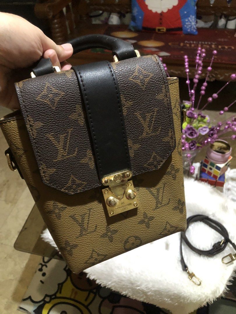 Louis Vuitton Monogram Canvas Top Handle Bag (Category: Luxury Bags & Wallets) located in Meycauayan. Submitted by miletteaqu82717 (Listing ID 1466004313, Image 2). Description: Monogram canvas bag, dual tone print with darker flap. Black leather top handle and vertical front strap. Gold tone lock closure on the front. Bottom has four metal feet studs. Interior lined in light brown fabric with an internal pocket and Louis Vuitton Paris Made in Fr