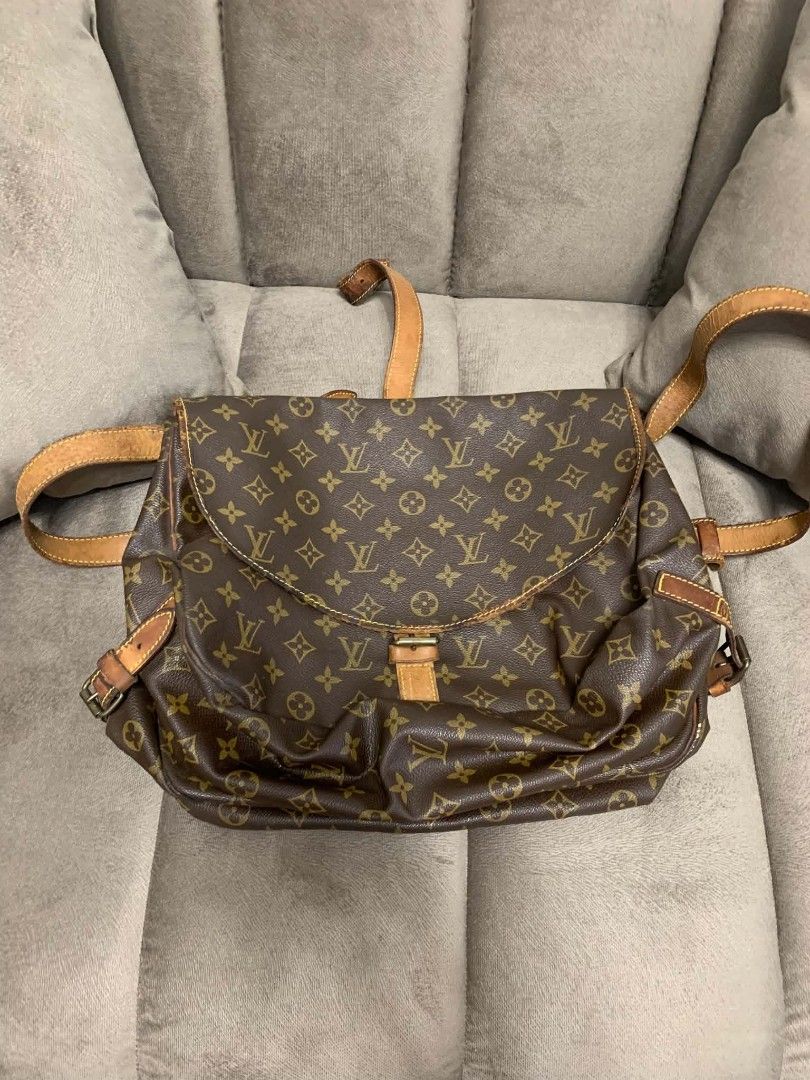 Louis Vuitton Monogram Canvas Saumur Backpack Bag (Category: Luxury Bags & Wallets) located in Marikina City. Submitted by mitch_arc444 (Listing ID 1466071882, Image 2). Description: - Brand: Louis Vuitton - Material: Monogram Canvas with Vachetta leather trim - Origin: Made in France (Date Code: Negotiable AR0912) - Interior: Brown textile lining with an open compartment - Closure & Straps: Buckle closure flap and adjustable shoulder straps - Co